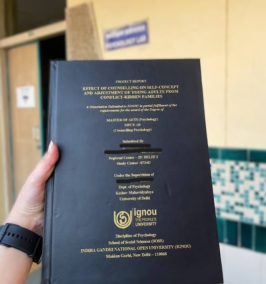 Hard-bound IGNOU project reports at the binding desk
